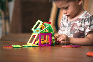 baby playing the magnetic tiles