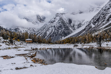White mountains and lake view in autumn after snow