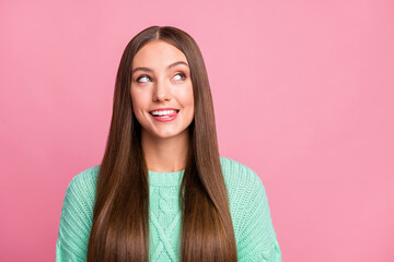 Close up portrait of adorable person bite tongue look empty space turquoise pullover isolated on pink color background