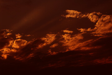 Sky cloudy orange night dramatic beautiful.  Dark sunset beauty bright cloud color idyllic light nature. Outdoors red storm sun sunligh ttime weather. Clouds abstract background.
