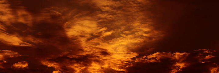 Sunset sky and sunrise orange bright abstract. Beautiful summer evening yellow clear cloud color day for wallpaper backdrop background.
