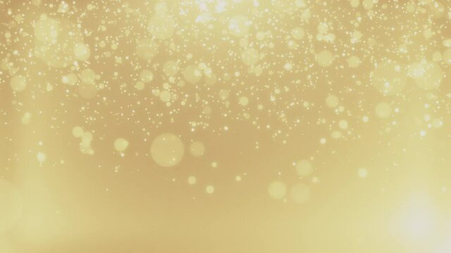 Warm festive backdrop. Christmas blurred dots. Defocused particles background. Bokeh lights. Gold glitter. 3840x2160 4k seamless loop video