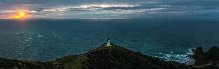 Fototapeta na wymiar panoramic sunset with lighthouse