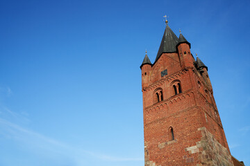 tower of the historic church "St. Petri" in Westerstede (Germany) against blue sky