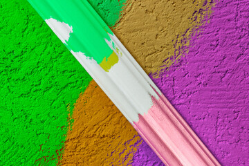 Rough plaster surface painted in a bright color. Variations of harmony and color compatibility in...