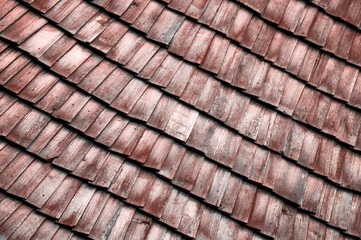 old roof made of wood. wooden background. texture with roof tiles. a lot of folded boards