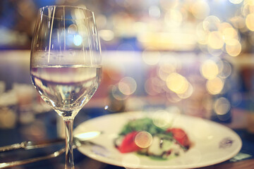evening in a restaurant, blurred abstract background, bokeh, alcohol concept, wine glasses in a bar