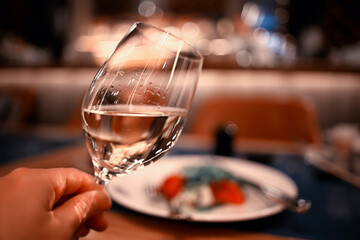 evening in a restaurant, blurred abstract background, bokeh, alcohol concept, wine glasses in a bar