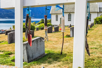 Fototapeta na wymiar Churchyard in Nes village at fjord, Norway