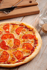 Closeup on margherita pizza with tomatoes 