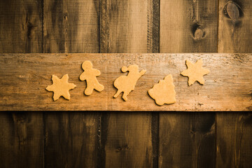 Gingerbread cookies on the wooden table before Christmas. Christmas traditions. Christmas decorations. 