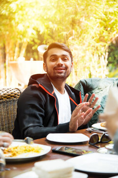 Group Of Asian Indian Friends Or People Having Breakfast Or Lunch Together.