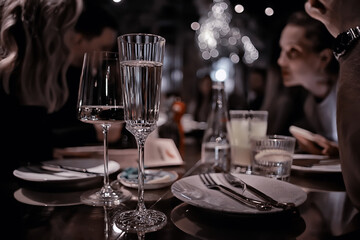 restaurant table view evening wine glass, friends at the party