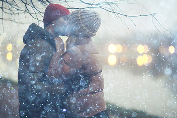couple in love winter evening hugging outside, seasonal abstract background, weather twilight rain