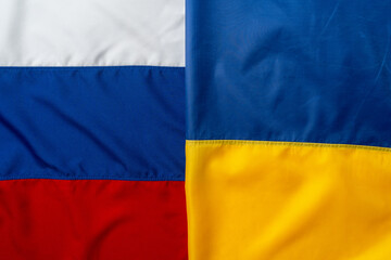 Flags of Russia and Ukraine folded together