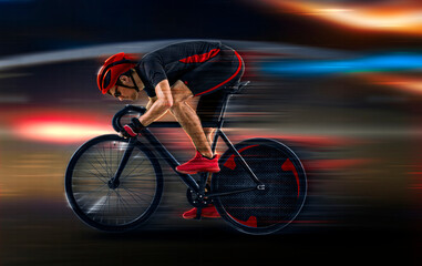 Fototapeta premium Man racing cyclist on dark background
