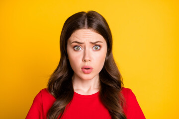 Fototapeta premium Portrait of frustrated girl horrible terrible novelty isolated over vivid color background