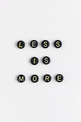 LESS IS MORE beads word typography