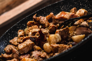 meat pieces on a grill
