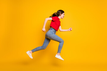 Fototapeta na wymiar Full body profile side photo of positive cheerful girl jump run discounts wear isolated over shine color background