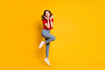 Fototapeta na wymiar Full size photo of cheerful attractive girl jump wear sneakers isolated over vivid color background