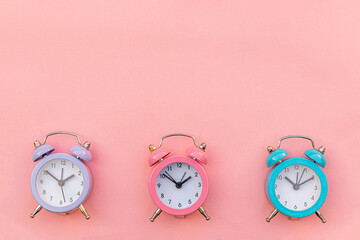 Simply minimal design three ringing twin bell classic alarm clock Isolated on pink pastel...