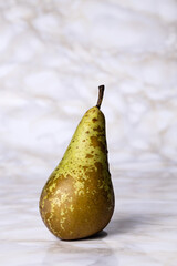 Conference pear on light marble background