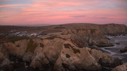 Fototapeta na wymiar Bodega Head showing off her cotton candy sky...