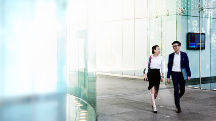 Happy colleagues in a discussion while walking