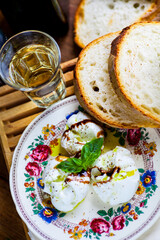 Close up of a traditional Italian dish with mozzarella and fresh basil. Selective focus - shallow depth of field.
