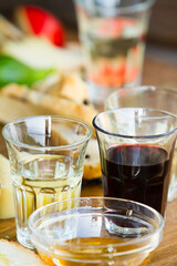 Rustic table with assortment of wine glasses. Selective focus - shallow depth of field.