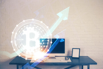 Double exposure of blockchain theme hologram and table with computer background. Concept of bitcoin...
