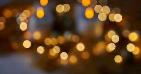 blurry background of shiny golden christmas lights against dark background - can also be used for...