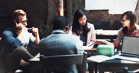 Diverse business colleagues meeting in a cafe