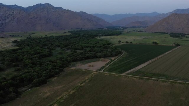 Weldon agricultural farmland in Kern County, California, dusk aerial view