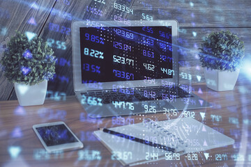 Double exposure of forex chart and work space with computer. Concept of international online trading.