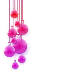 Pink christmas tree balls hanging on ribbons with bow.