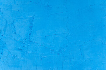 blue background of a plastered wall close up