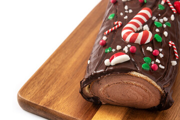 Chocolate yule log christmas cake isolated on white background
