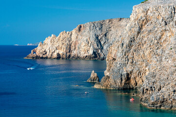 Obraz premium overview of Cala Domestica with crystal clear water and Mediterranean vegetation, Sardinia