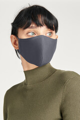 Face mask mockup on a women in a green turtleneck top