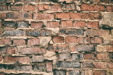 Old weathered brick wall fragment .