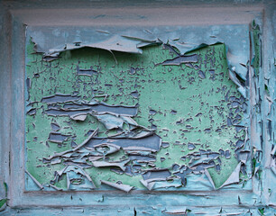 Green paint peeling from wood