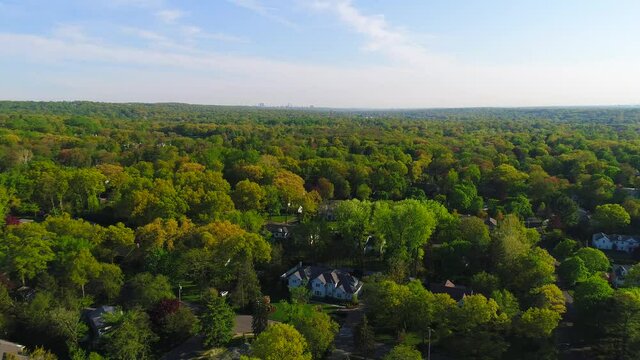 Beautiful View of Suburban Luxury Home Surrounded in Lush Trees - Dolly Shot