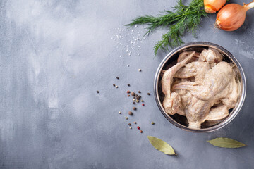Marinated chicken wings ready to cook. Top view, text space