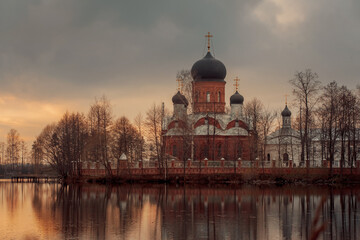 Fototapeta na wymiar Holy Vvedensky island hermitage - Orthodox female monastery on island on Vvedensky lake, Pokrov, Russia