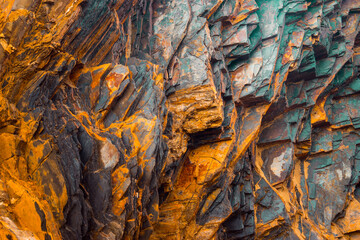 Rock layers , a colorful formation of rocks stacked over time. Interesting background a fascinating texture - 393315183