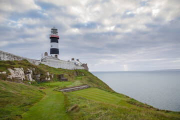 Fototapeta na wymiar The Lighthouse At The Old Head Of Kinsale With The 18th Tee Box