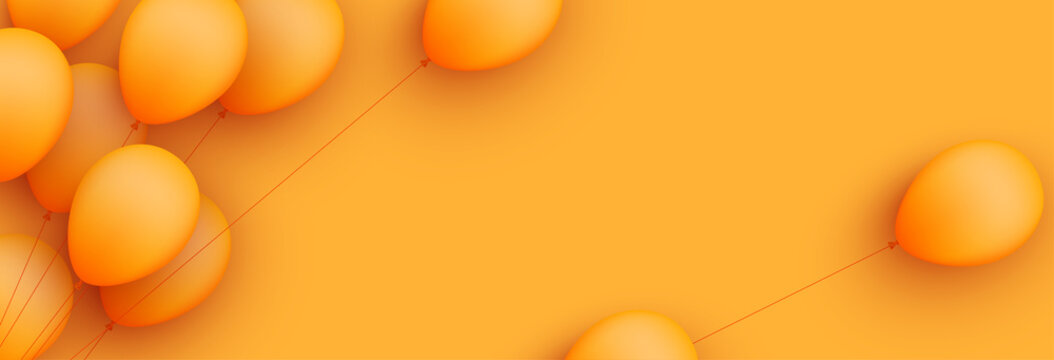 Orange balloons with threads on orange background.