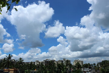 Clear blue sky and white floating cloud on a bright day.